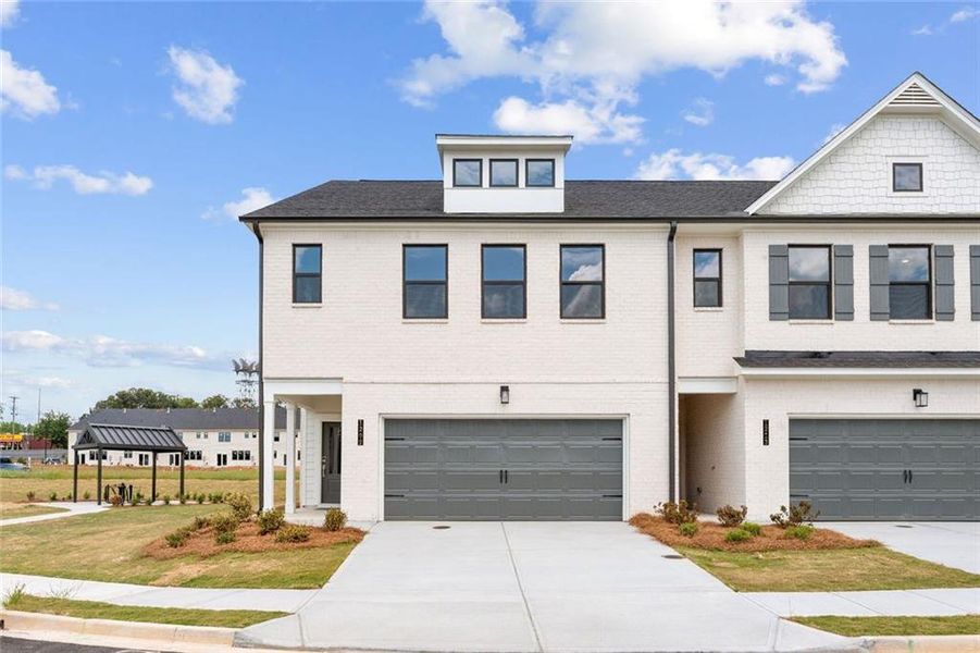 Front exterior of a new home in Magnolia Square, Austell, GA, highlighting curb appeal (Image 1). Front exterior of a new home in Magnolia Square, Austell, GA, highlighting curb appeal (Image 1).