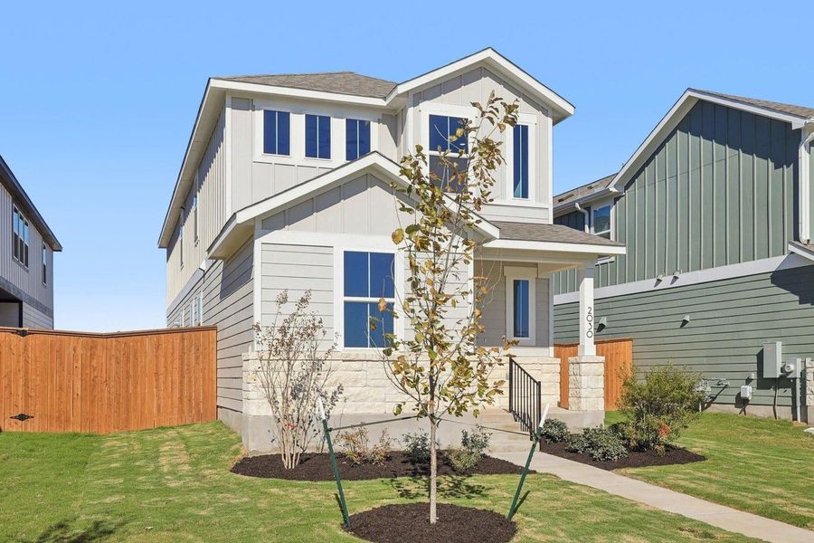 Front exterior of a new home in The Hollows at Avery Centre, Round Rock, TX, highlighting curb appeal (Image 21).