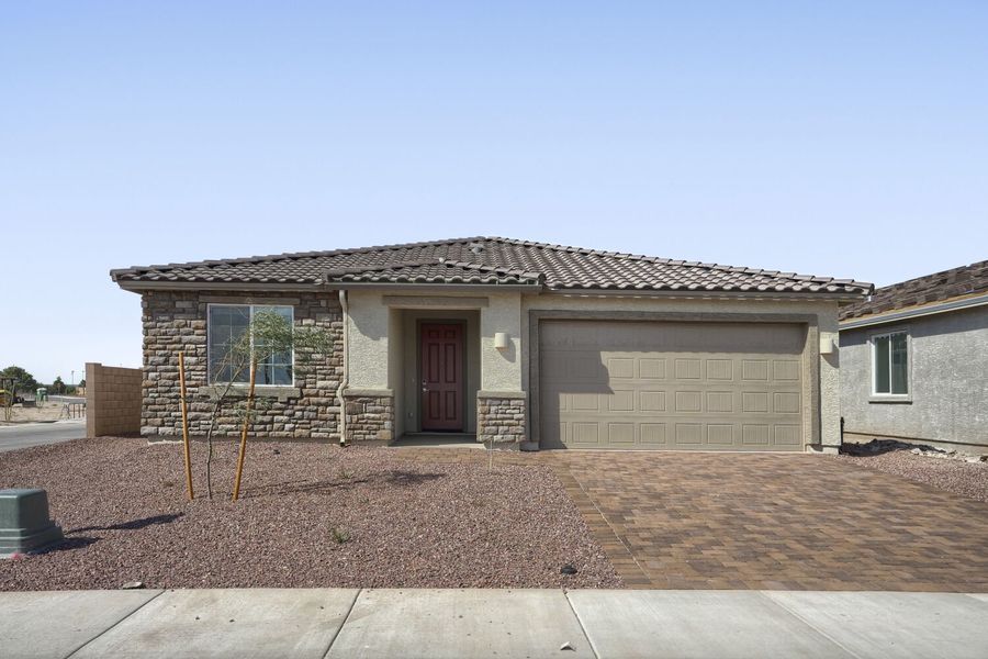 Front exterior of a new home in Monarch, Marana, AZ, highlighting curb appeal (Image 1). Front exterior of a new home in Monarch, Marana, AZ, highlighting curb appeal (Image 1).