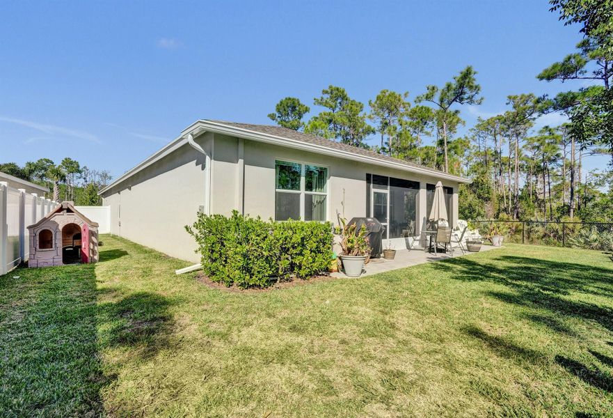 Exterior details and patio area of a home in Preserves at Park Trace, Stuart (Image 24).