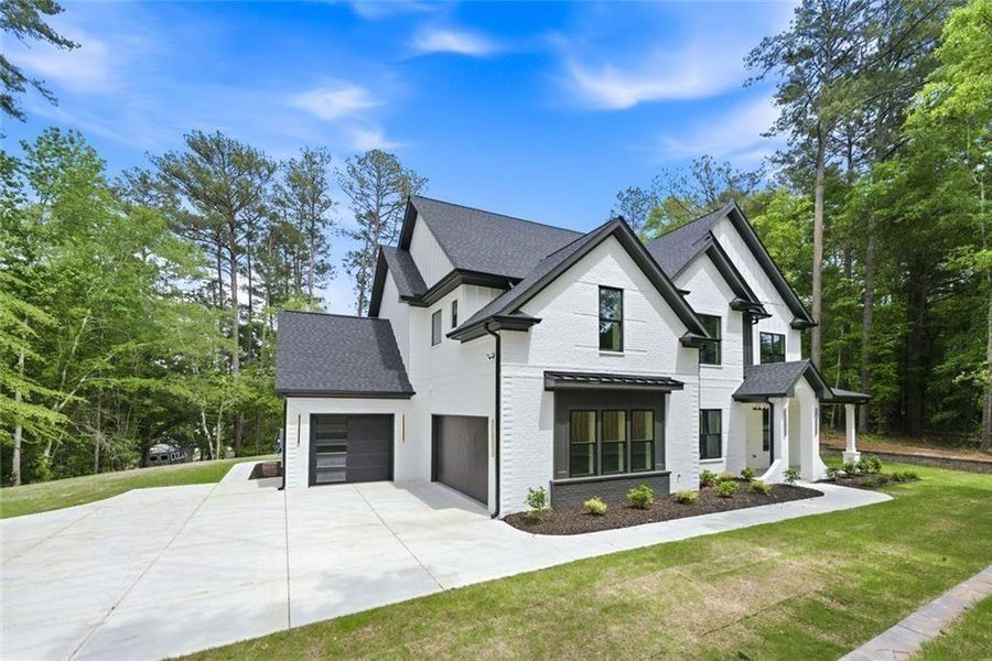 Front exterior of a new home in , Lawrenceville, GA, highlighting curb appeal (Image 25).