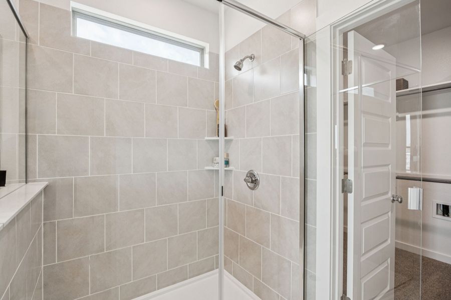 Primary Bathroom in the Trinity home plan by Trophy Signature Homes – REPRESENTATIVE PHOTO