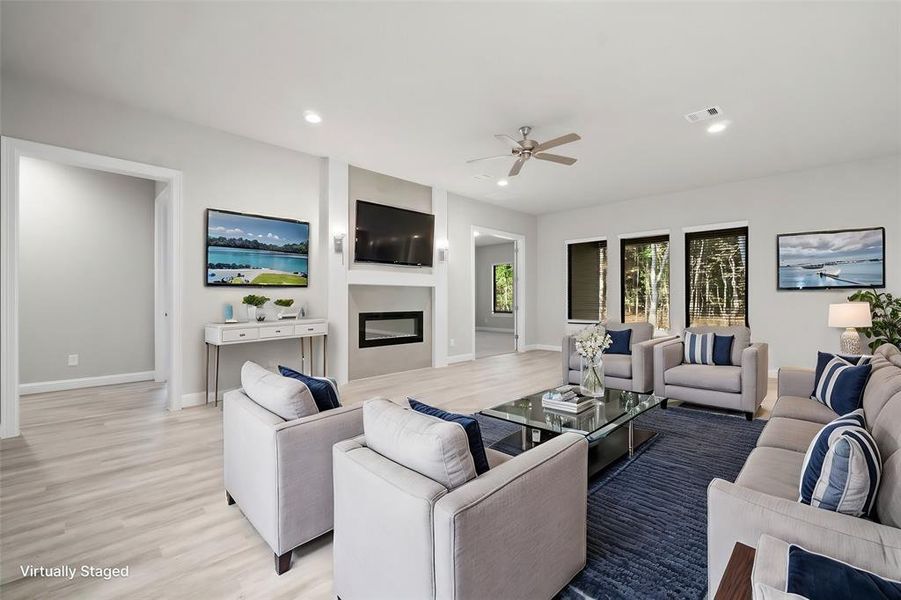 Spacious family room featuring a modern fireplace.