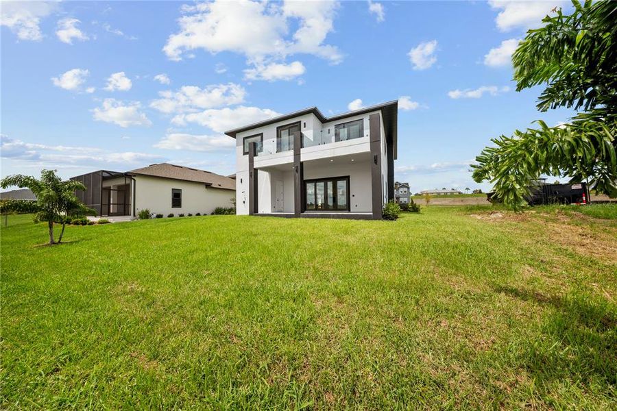 Front exterior of a new home in , Lake Alfred, FL, highlighting curb appeal (Image 32).