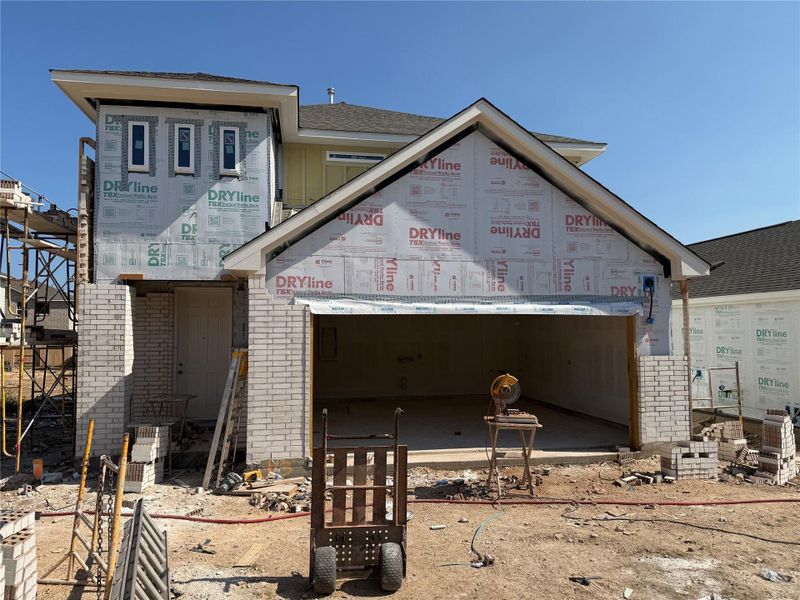Front exterior of a new home in The Cottages at La Cima, San Marcos, TX, highlighting curb appeal (Image 10). Front exterior of a new home in The Cottages at La Cima, San Marcos, TX, highlighting curb appeal (Image 10).