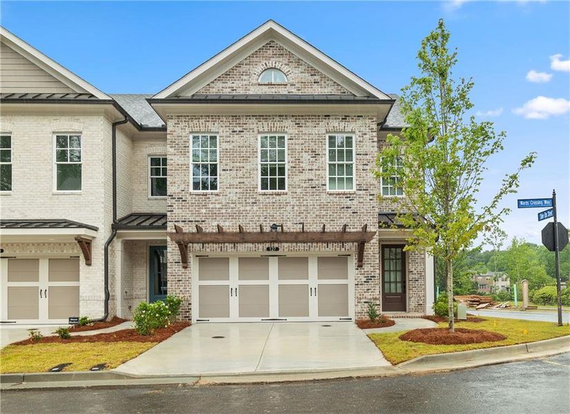 Front exterior of a new home in Waterside Townhomes, Peachtree Corners, GA, highlighting curb appeal (Image 13).