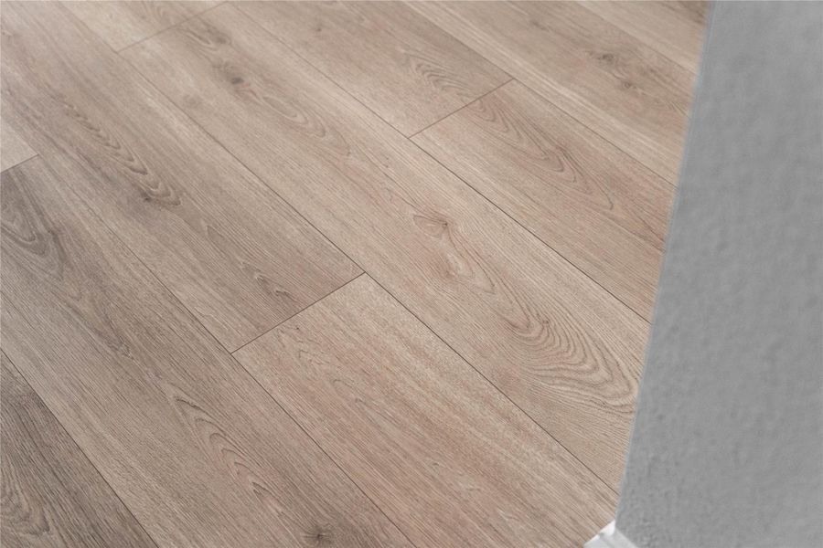 The RevWood laminate flooring in Sailcloth is seen throughout the main living areas.