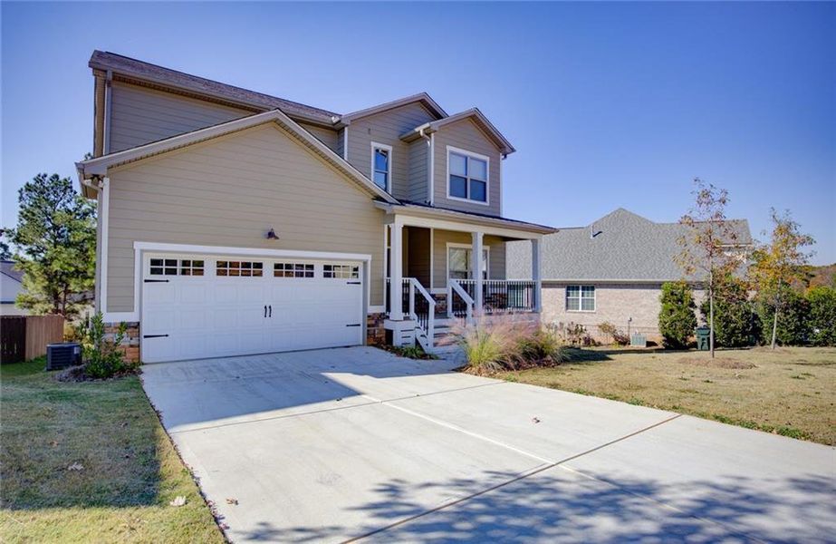 Front exterior of a new home in , Covington, GA, highlighting curb appeal (Image 20).