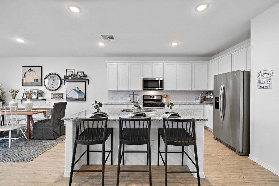 A kitchen with a large island. A kitchen with a large island.
