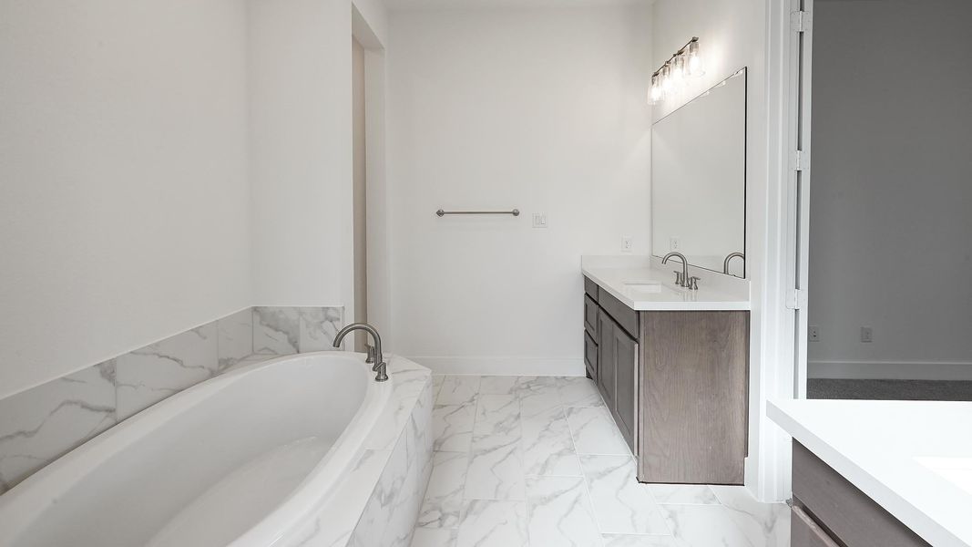 Furnished interior view inside a new home in 6 Creeks 60', Kyle (Image 11).