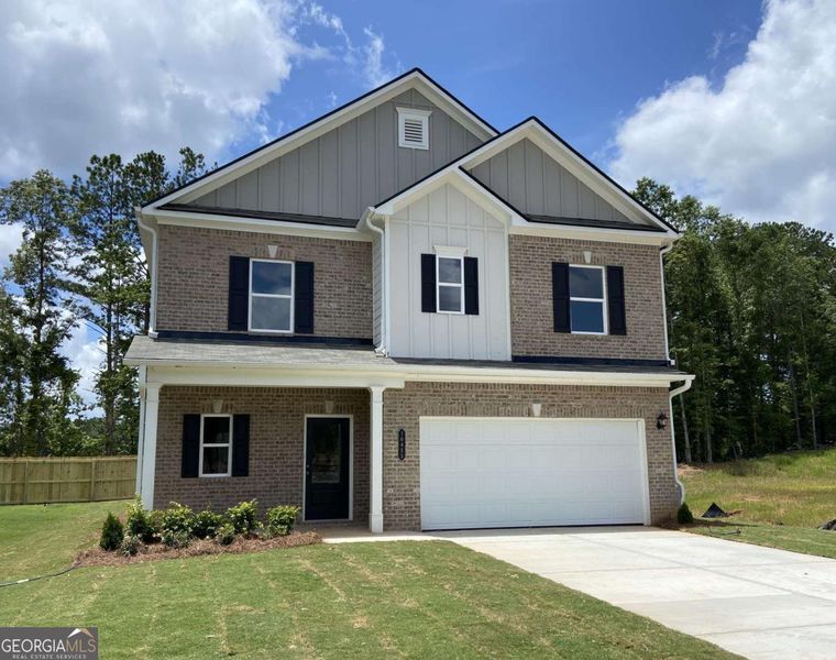 Front exterior of a new home in Trellis Park, Hampton, GA, highlighting curb appeal (Image 1).