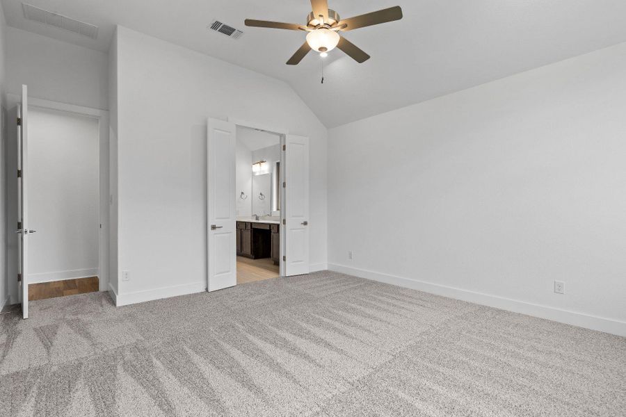 Primary Bedroom with elevated ceiling Primary Bedroom with elevated ceiling