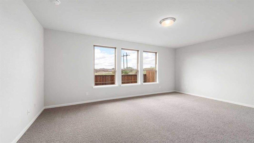 Unfurnished room with carpet