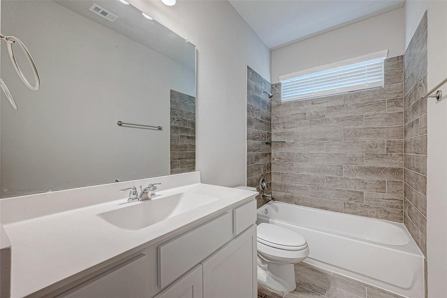 Furnished interior view inside a new home in Mill Creek Trails, Magnolia (Image 13).