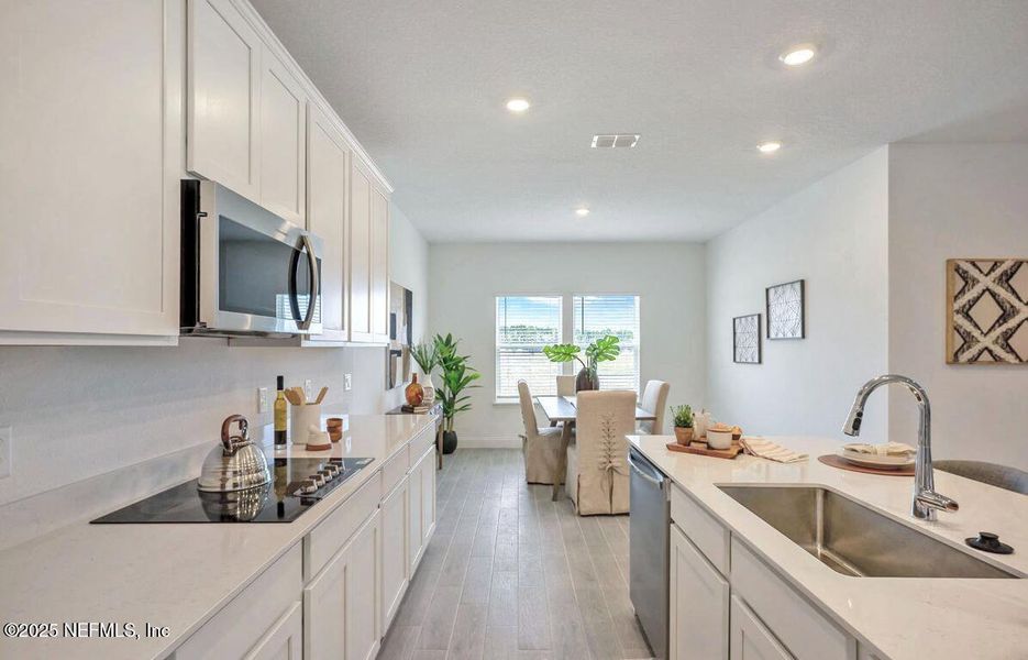 Furnished interior view inside a new home in Edenbrooke at Hyland Trail | 55+: Edenbrooke at Hyland Trail 60s, Green Cove Springs (Image 5).