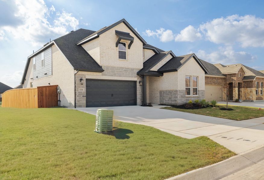 Front exterior of a new home in Walden Pond, Forney, TX, highlighting curb appeal (Image 24).