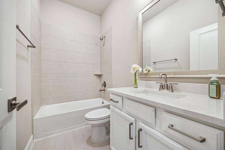 Front bathroom with tub/shower combo.