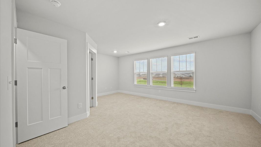 Spacious and serene primary suite with thoughtful design in a desirable DRB Homes community