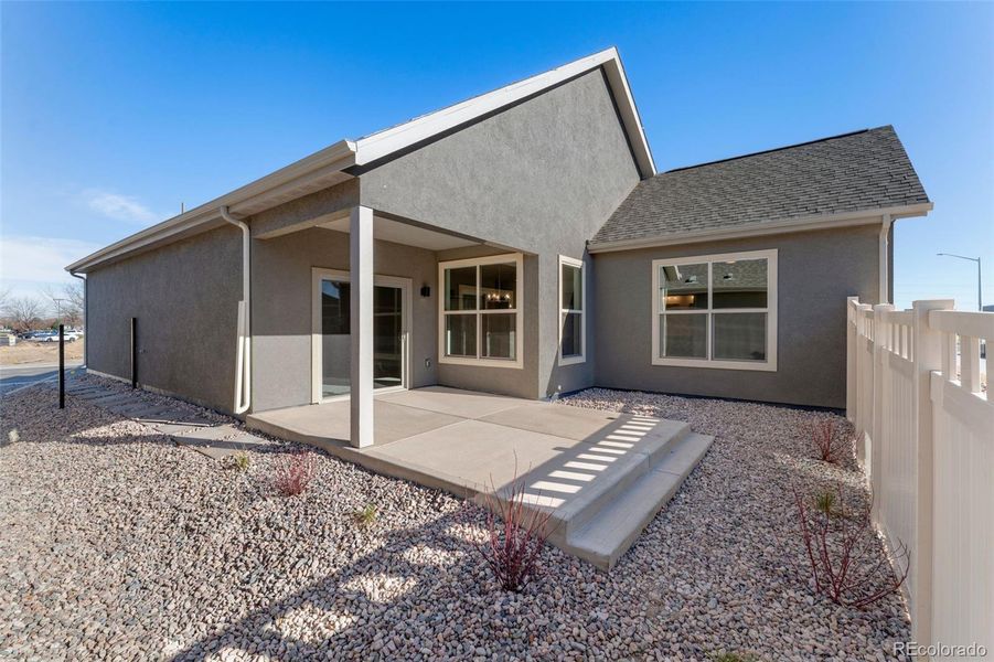 Exterior details and patio area of a home in The Courtyards at Lupton Village, Fort Lupton (Image 21).