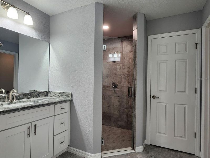 Primary Bathroom with private commode and linen closet