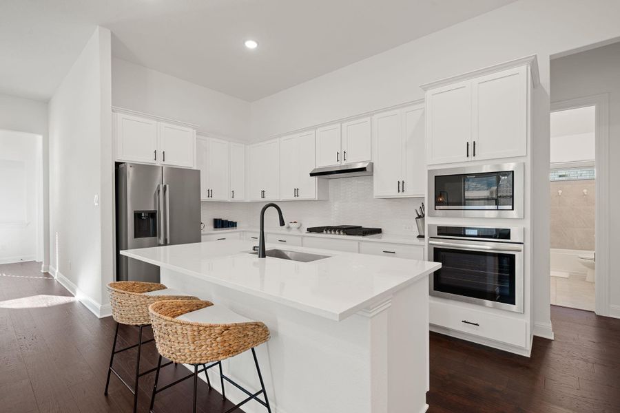 White cabinetry define this well-appointed kitchen. White cabinetry define this well-appointed kitchen.