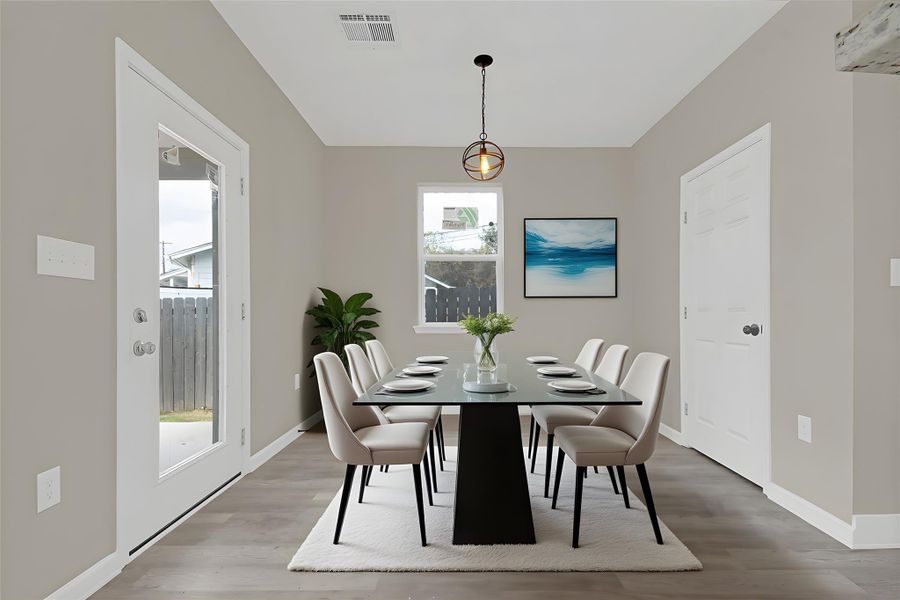 Dining space with wood finished floors
