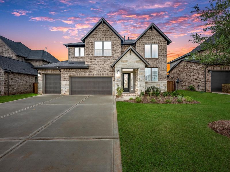 Front exterior of a new home in Clopton Farms, Montgomery, TX, highlighting curb appeal (Image 1). Front exterior of a new home in Clopton Farms, Montgomery, TX, highlighting curb appeal (Image 1).