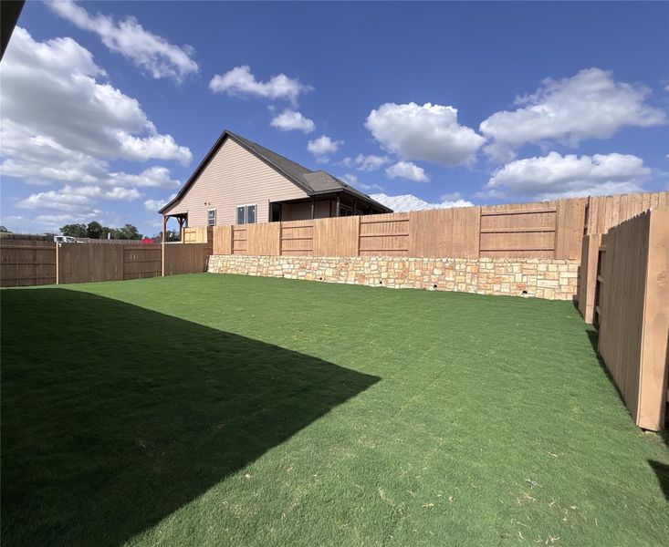 Front exterior of a new home in The Colony 50s, Cedar Creek, TX, highlighting curb appeal (Image 14).
