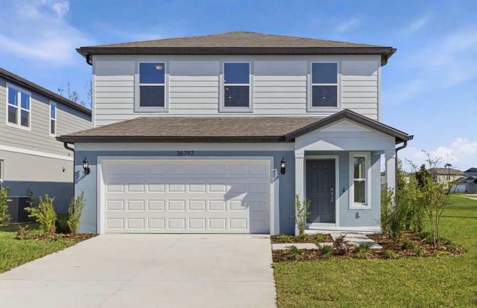 Representative exterior photo of a completed home built from the Williston by Pulte Homes in Riverwood, Zephyrhills, FL (Image 21).