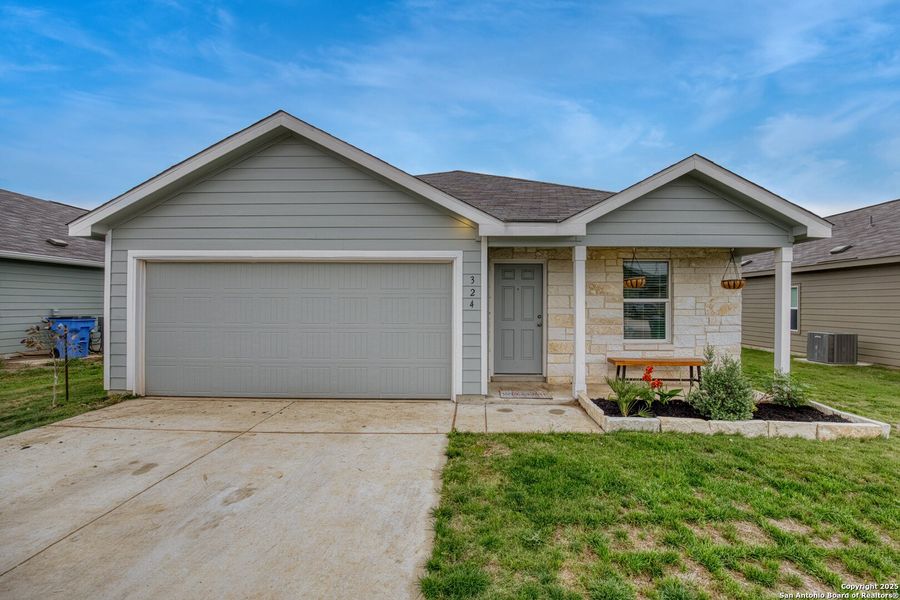 Front exterior of a new home in Guadalupe Heights: Watermill Collection, Seguin, TX, highlighting curb appeal (Image 21). Front exterior of a new home in Guadalupe Heights: Watermill Collection, Seguin, TX, highlighting curb appeal (Image 21).