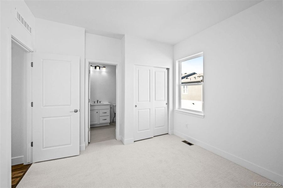 2nd bedroom with high ceilings & ensuite.