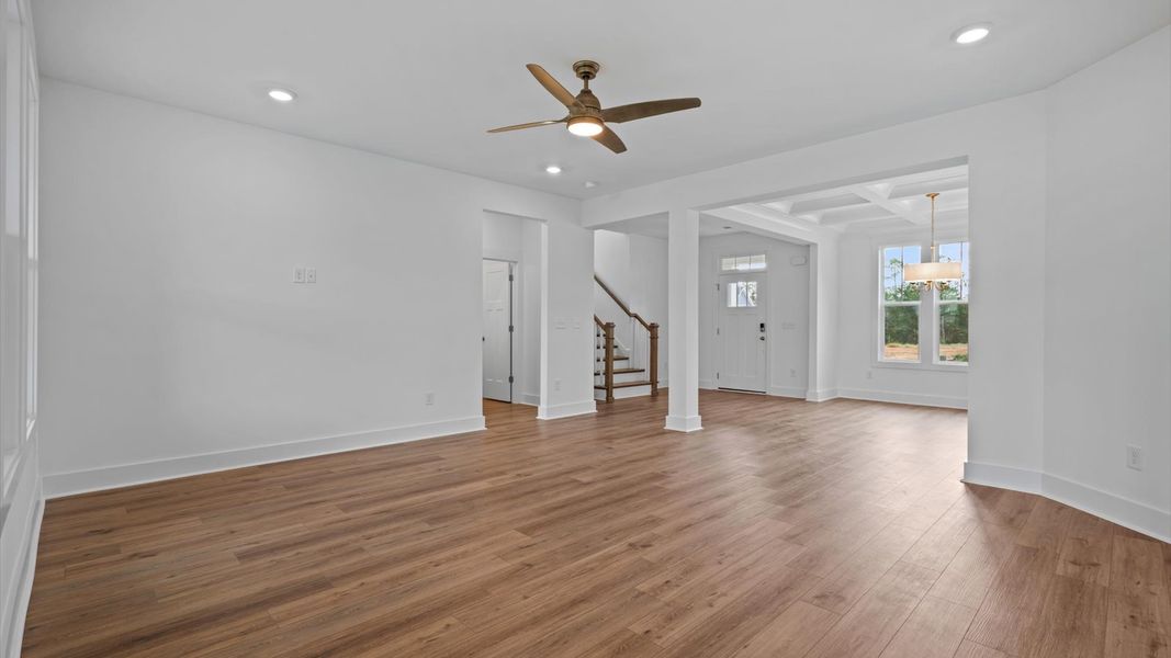 Memorable moments begin in this elegant, open family room with hardwood flooring and refined finishes