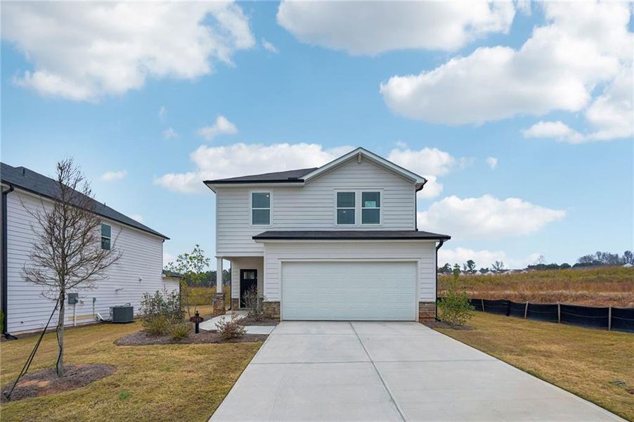 Front exterior of a new home in Avalon - Reserve Series, Conyers, GA, highlighting curb appeal (Image 2). Front exterior of a new home in Avalon - Reserve Series, Conyers, GA, highlighting curb appeal (Image 2).
