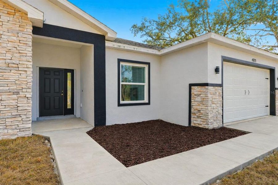 Exterior details and patio area of a home in , Indian Lake Estates (Image 4).