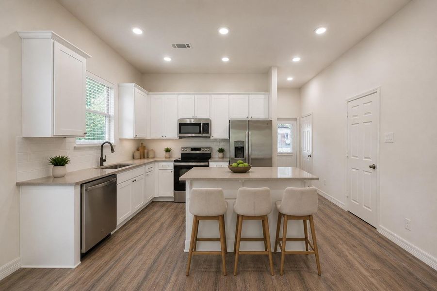 Experience modern elegance with stunning quartz countertops and a brand new fridge included in your new home!