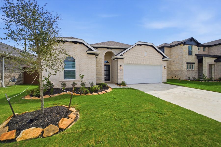Front exterior of a new home in Creekhaven, Arcola, TX, highlighting curb appeal (Image 2).