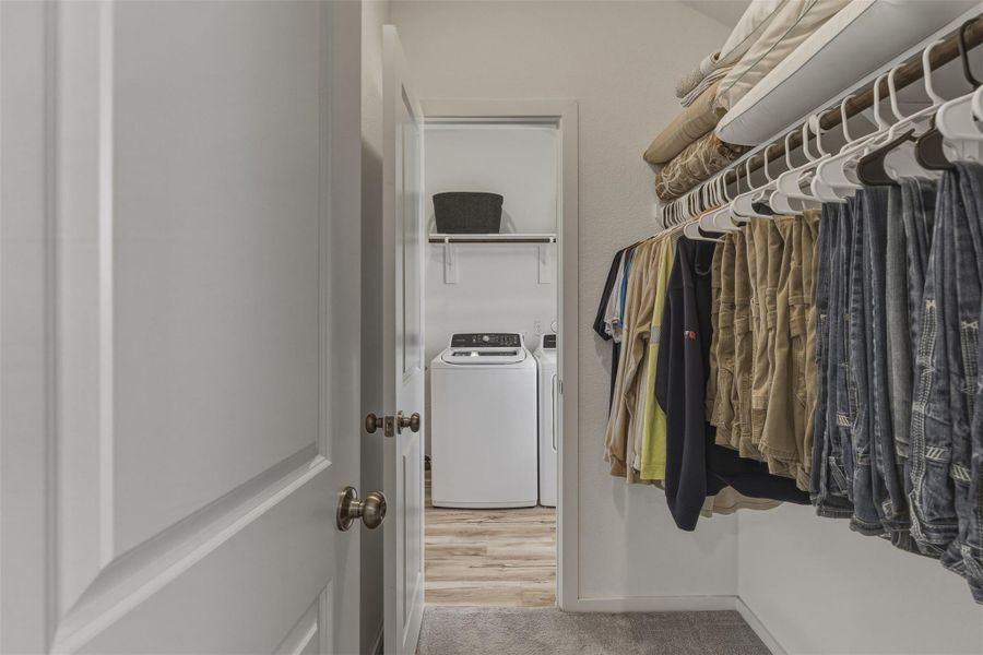 one of the massive his/her closets, connects to laundry room