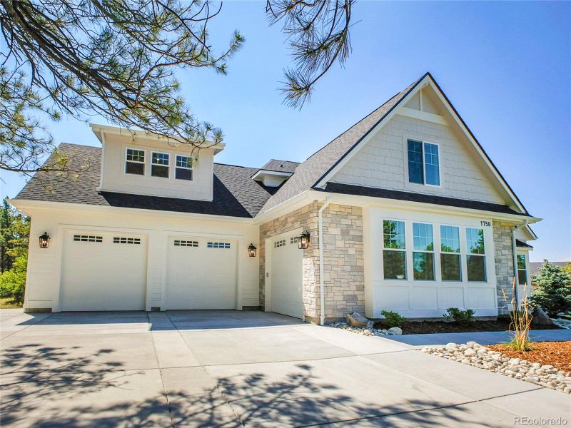 Front exterior of a new home in , Franktown, CO, highlighting curb appeal (Image 25).