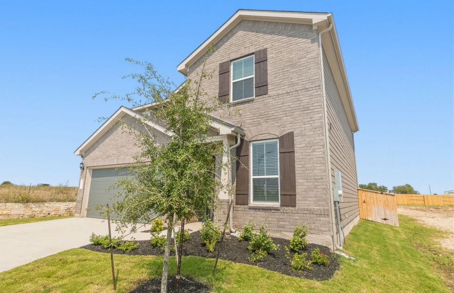 Front exterior of a new home in Patterson Ranch, Georgetown, TX, highlighting curb appeal (Image 20).