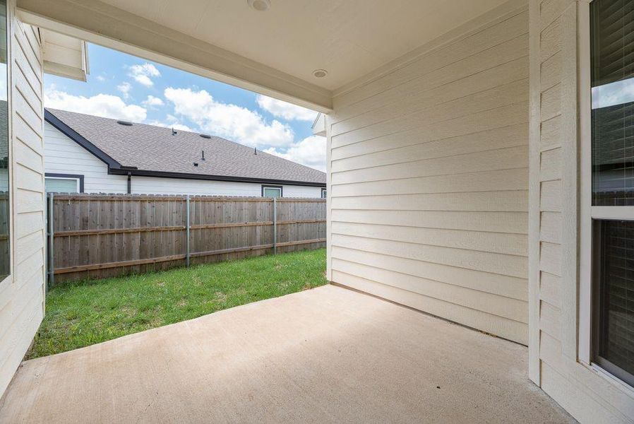 Exterior details and patio area of a home in , Tom Bean (Image 3).