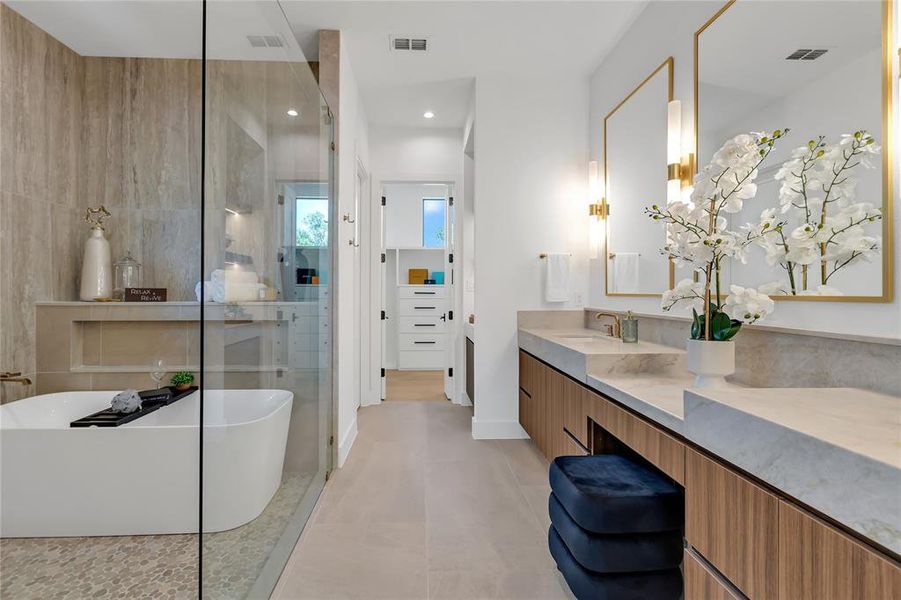 Full bathroom featuring vanity, a freestanding bath, a shower stall, tile patterned floors, and recessed lighting Full bathroom featuring vanity, a freestanding bath, a shower stall, tile patterned floors, and recessed lighting