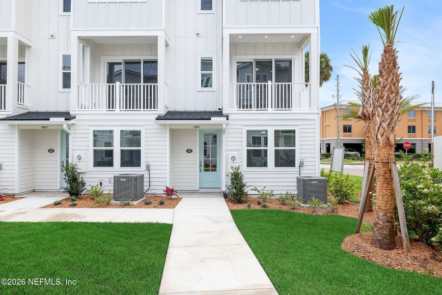 Exterior details and patio area of a home in North Beach Townhomes, Jacksonville Beach (Image 24).