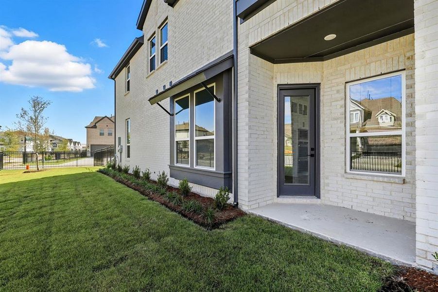 Exterior details and patio area of a home in Walsh: Townhomes - The Patios, Aledo (Image 2). Exterior details and patio area of a home in Walsh: Townhomes - The Patios, Aledo (Image 2).