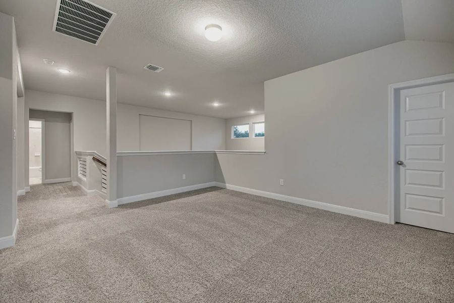 Representative unfurnished interior of a home built from the Shelby by Chesmar Homes in Buffalo Crossing, Cibolo (Image 31).
