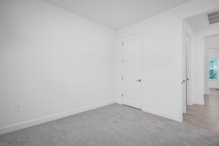 Spacious, unfurnished interior of a new home in The Cove at West Port, Port Charlotte (Image 14).