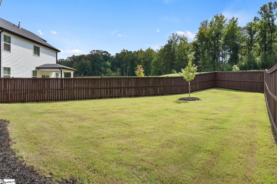 Exterior details and patio area of a home in Saratoga Oaks, Williamston (Image 24).