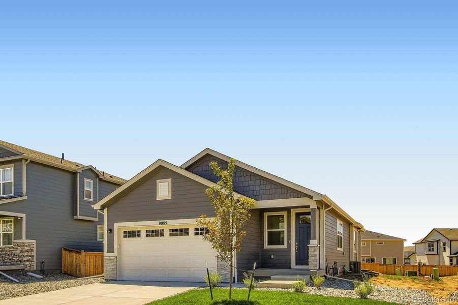Front exterior of a new home in Buffalo Highlands – Commerce City, Commerce City, CO, highlighting curb appeal (Image 1).