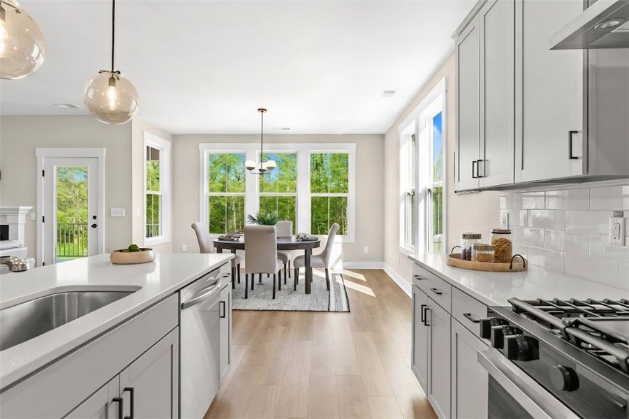 This bright kitchen with modern details and abunda