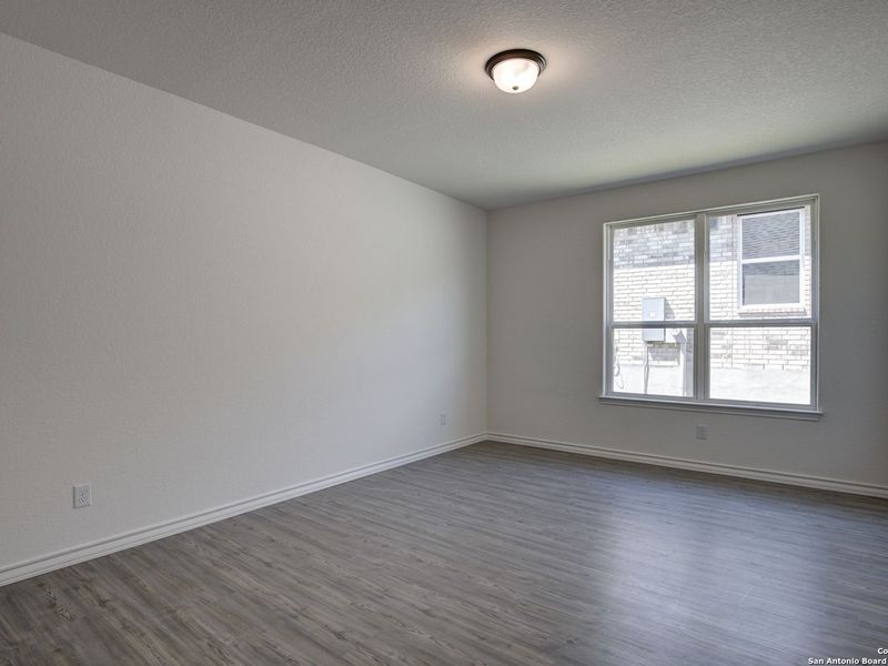 Spacious, unfurnished interior of a new home in The Reserve at Potranco Oaks, Castroville (Image 32).