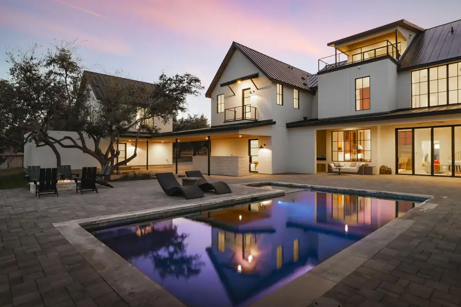 Rear view of house featuring a balcony, stucco siding, an outdoor living space, and a patio Rear view of house featuring a balcony, stucco siding, an outdoor living space, and a patio